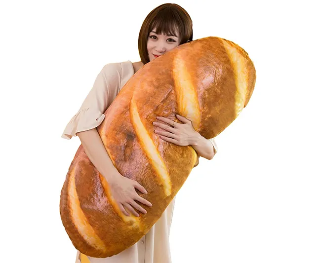 Plush bread-shaped pillow with a realistic design, made from soft cotton, perfect for home decor or as a quirky gift.