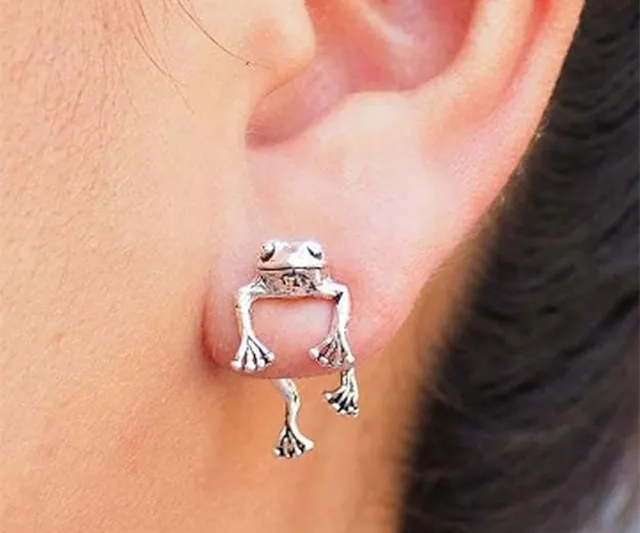 Close-up of silver frog-shaped stud earrings for women, with a cute animal design, featured on IGottaHaveItNow.